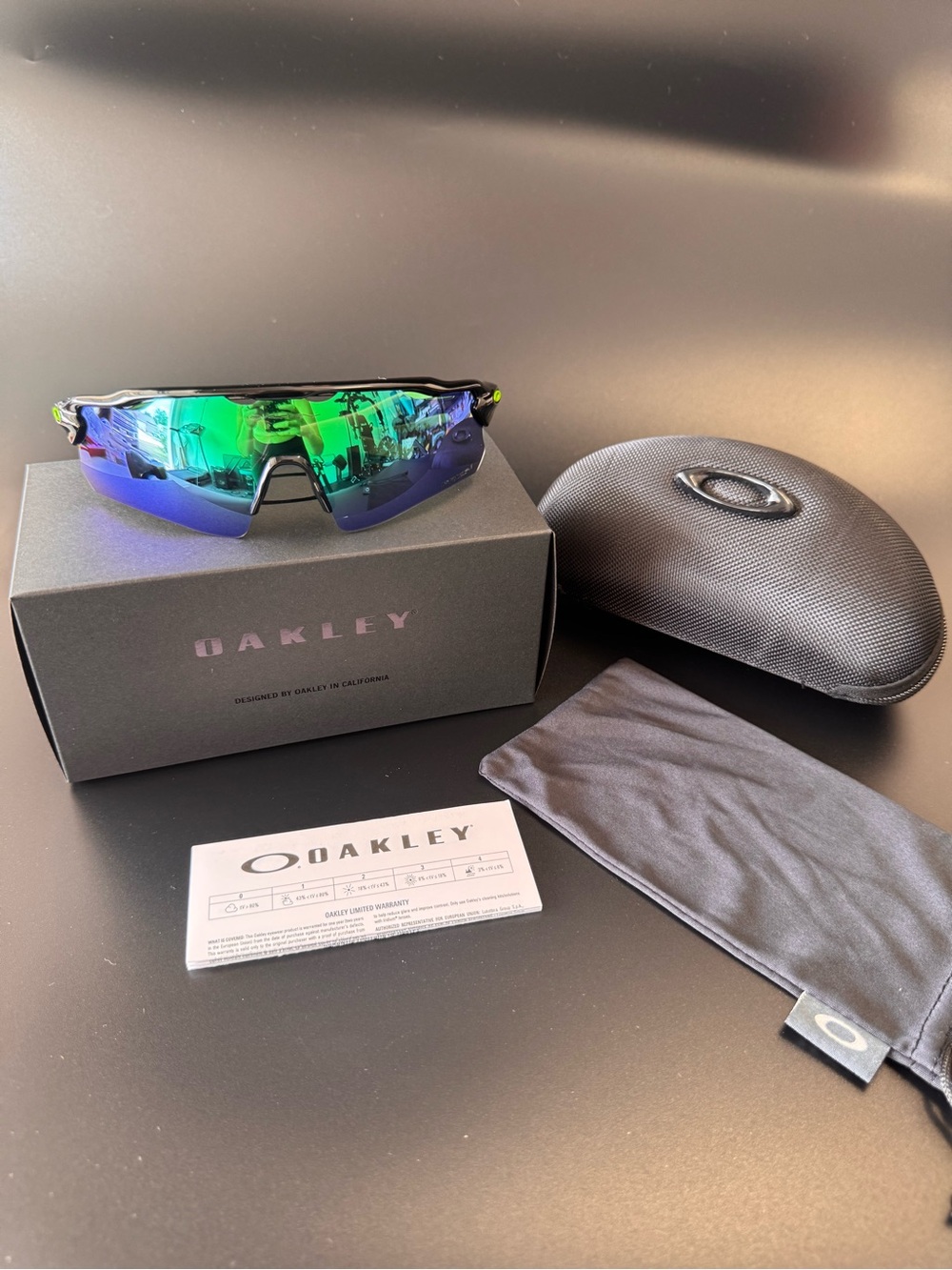 Oakley Sports Sunglasses - Black Frame with Green/Blue Mirrored Lens